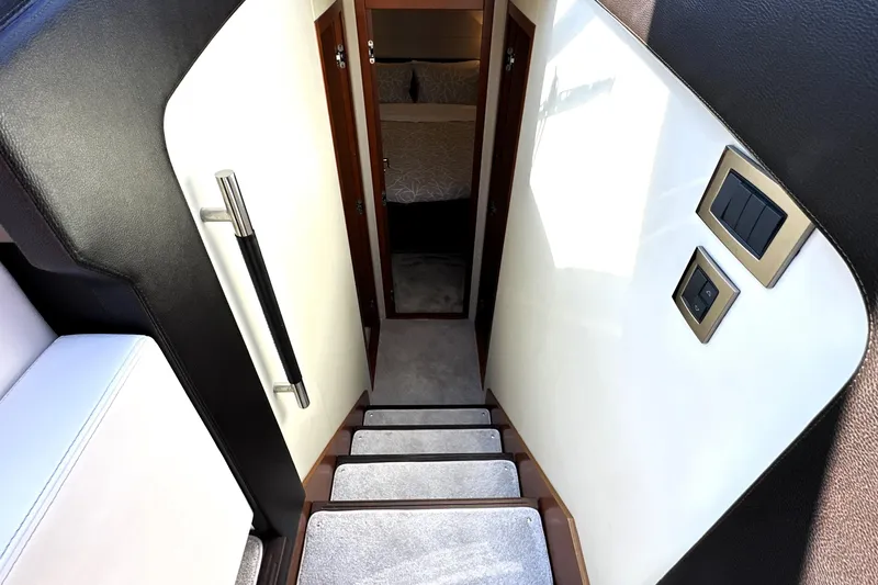 Slide: The Image of Staircase leading to cabin interior of 2016 Prestige 500 S yacht. - 31