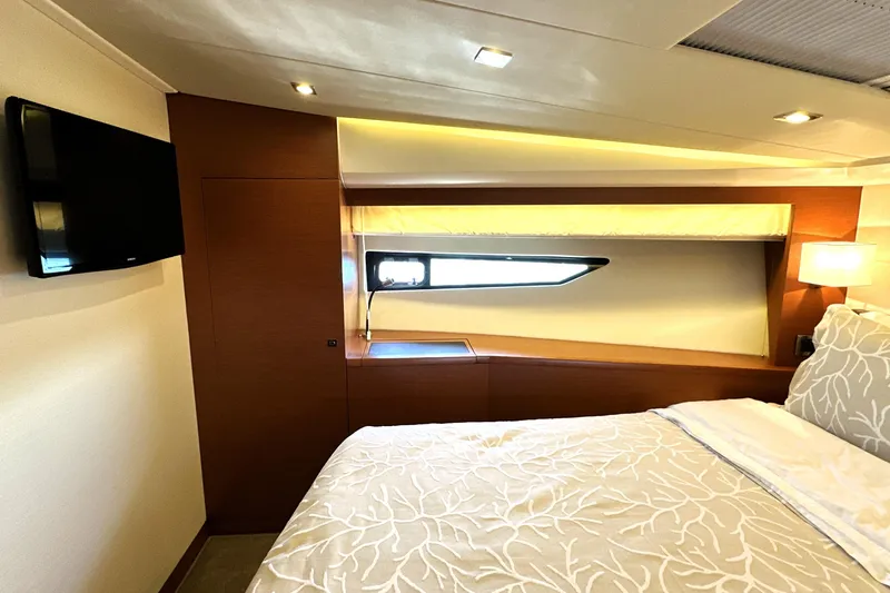 Slide: The Image of Luxurious bedroom interior of 2016 Prestige 500 S yacht with modern design and cozy lighting. - 33