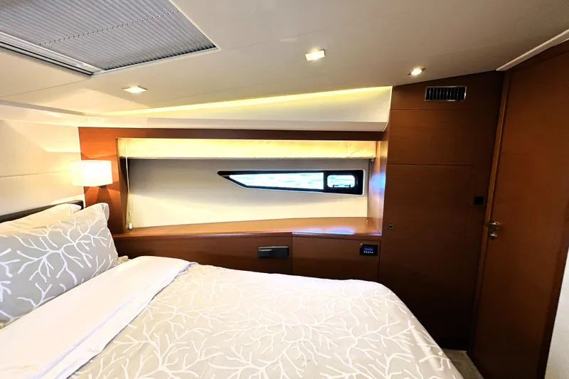 Slide: The Image of Luxurious cabin interior of 2016 Prestige 500 S yacht with elegant bedding and modern lighting. - 34