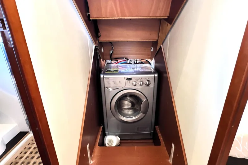 Slide: The Image of Compact washing machine in a 2016 Prestige 500 S yacht's wooden compartment. - 39