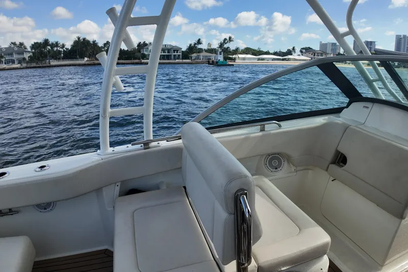 Slide: The Image of 2017 Boston Whaler 230 Vantage boat interior with ocean view and seating. - 20
