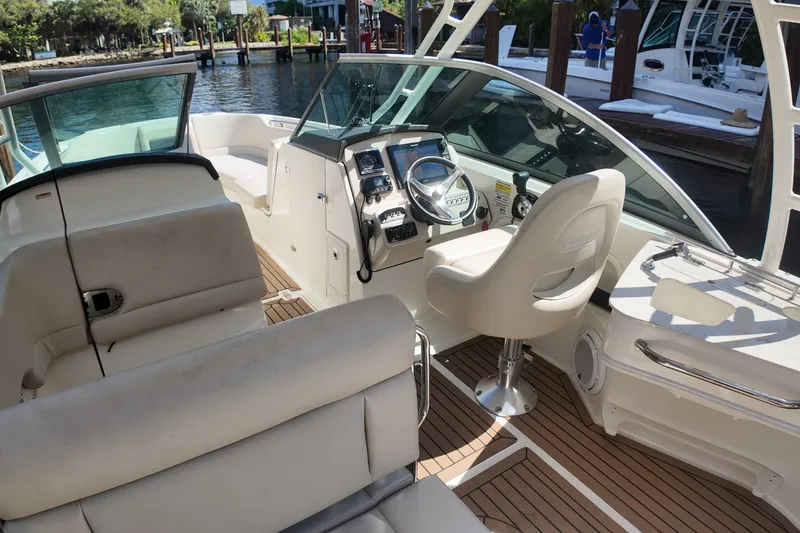 Slide: The Image of 2017 Boston Whaler 230 Vantage boat interior with helm and seating area. - 21