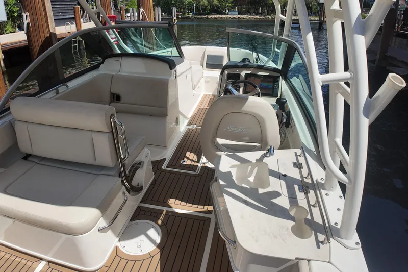 Slide: The Image of 2017 Boston Whaler 230 Vantage boat interior with seating and steering wheel. - 23