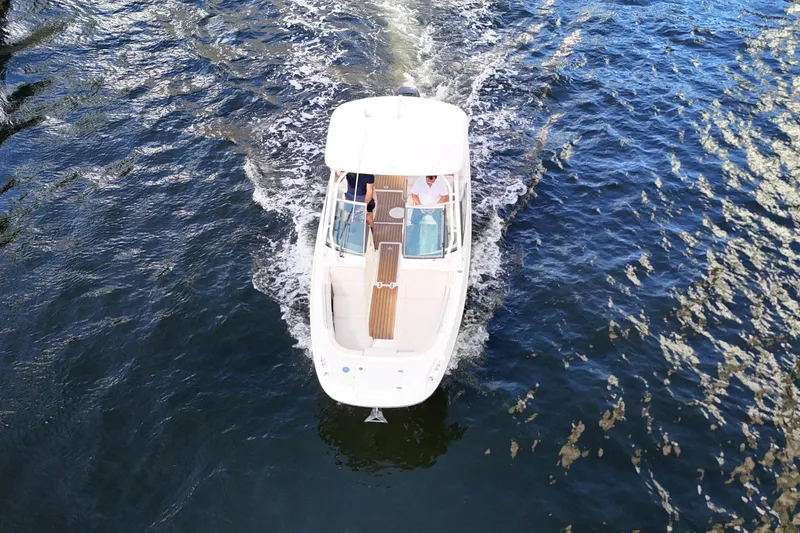 Slide: The Image of Overhead view of a 2017 Boston Whaler 230 Vantage boat cruising on water. - 6