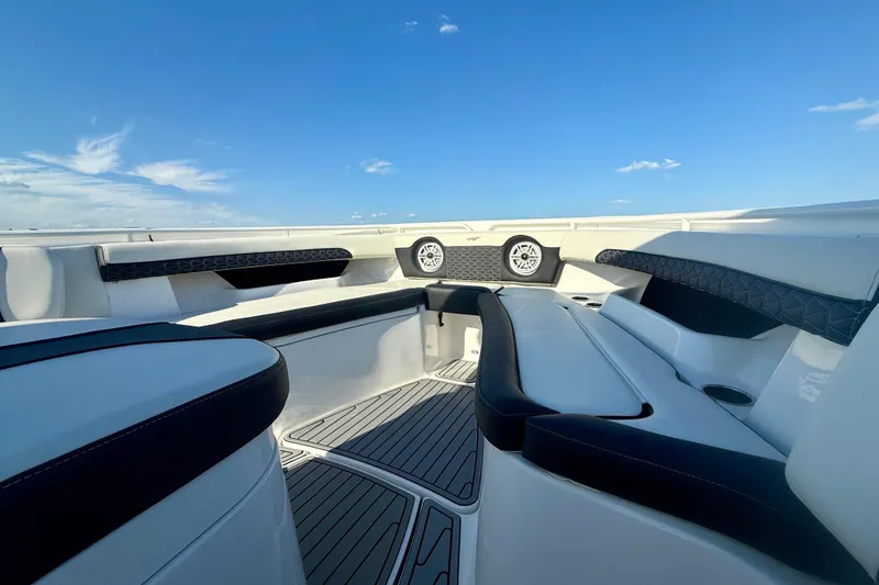 Slide: The Image of 2024 Tidewater 320 CC Adventure boat interior with sleek seating and modern design. - 16