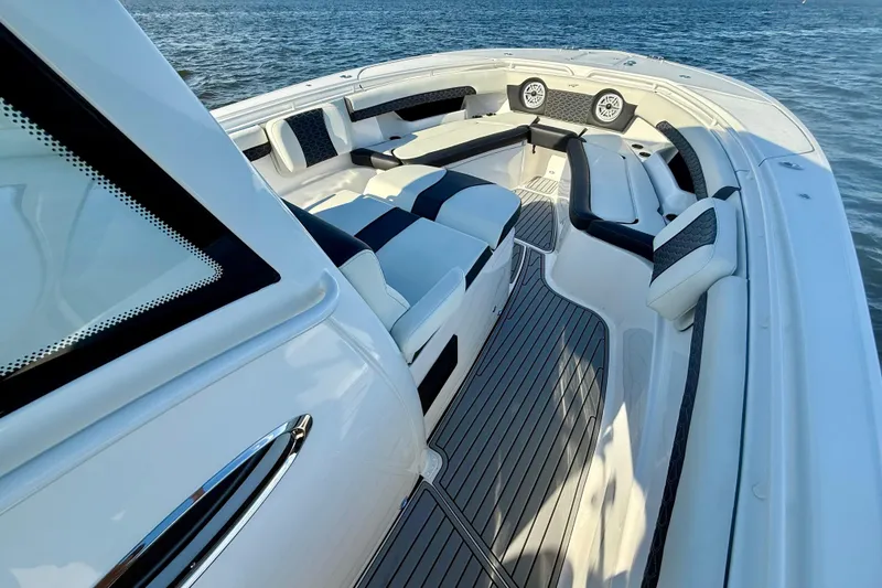 Slide: The Image of 2024 Tidewater 320 CC Adventure boat interior with luxurious seating and ocean view. - 18