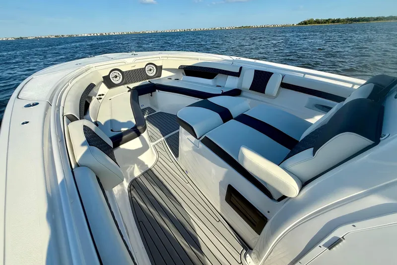 Slide: The Image of 2024 Tidewater 320 CC Adventure boat interior with luxurious seating on open water. - 19