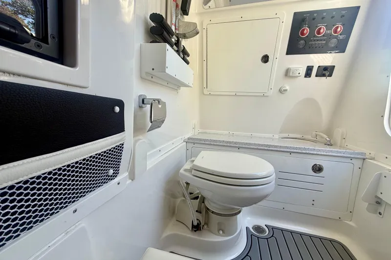 Slide: The Image of 2024 Tidewater 320 CC Adventure boat interior with modern bathroom amenities. - 36