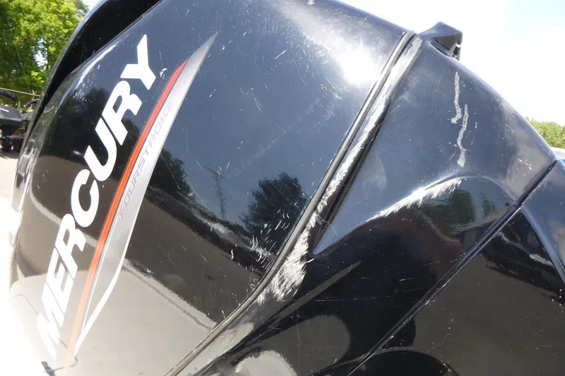 Slide: The Image of Close-up of a Mercury FourStroke engine on a 2024 Mako Pro Skiff 17 CC boat. - 12