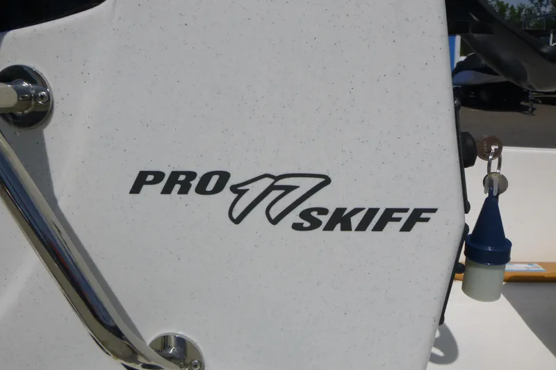 Slide: The Image of 2024 Mako Pro Skiff 17 CC logo on boat exterior. - 14
