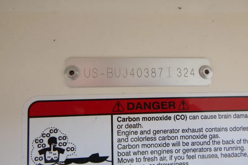 Slide: The Image of 2024 Mako Pro Skiff 17 CC warning label and serial number plate. - 15