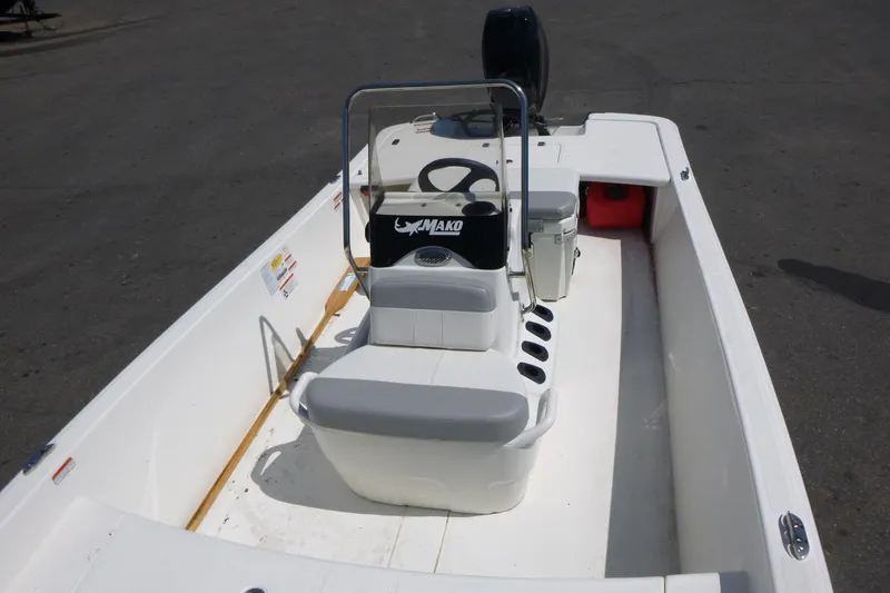 Slide: The Image of 2024 Mako Pro Skiff 17 CC boat interior with console and seating. - 6
