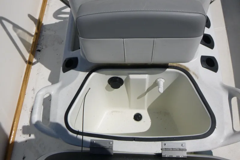 Slide: The Image of 2024 Mako Pro Skiff 17 CC boat seat with integrated storage compartment. - 8