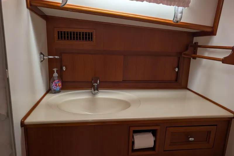 Slide: The Image of Luxurious bathroom sink area in 2006 Grand Banks 49 Eastbay SX yacht. - 58