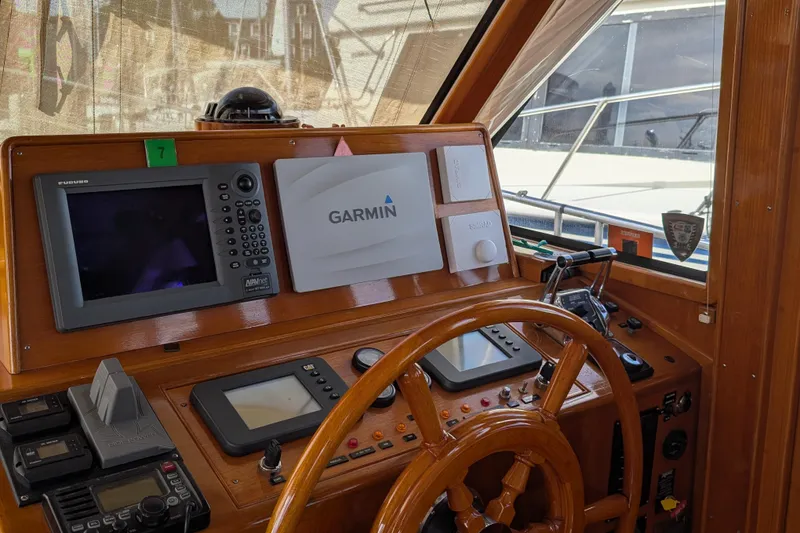 Slide: The Image of 2006 Grand Banks 49 Eastbay SX helm with Garmin and Furuno navigation systems. - 27