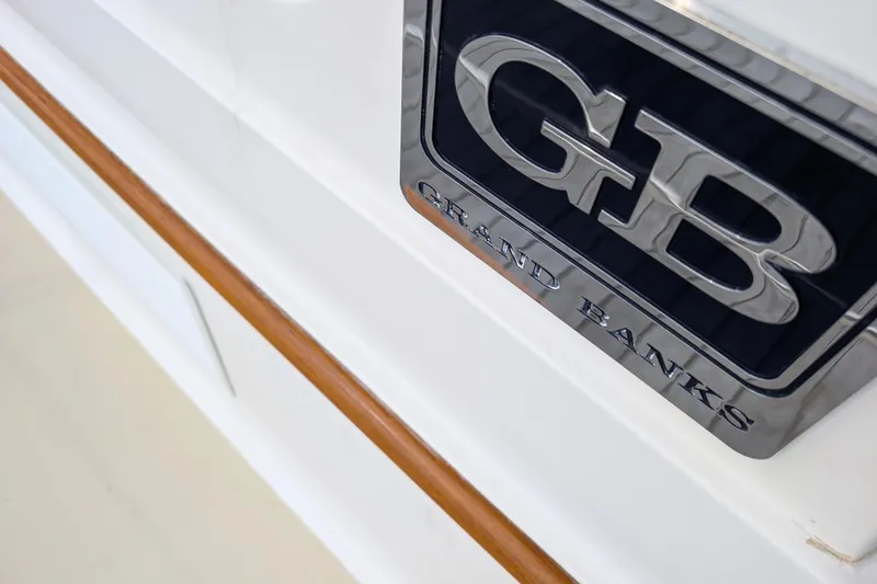Slide: The Image of 2006 Grand Banks 49 Eastbay SX yacht emblem with wood trim detail. - 6