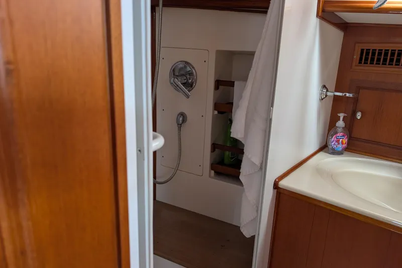 Slide: The Image of Bathroom interior of 2006 Grand Banks 49 Eastbay SX yacht, featuring shower and sink. - 57