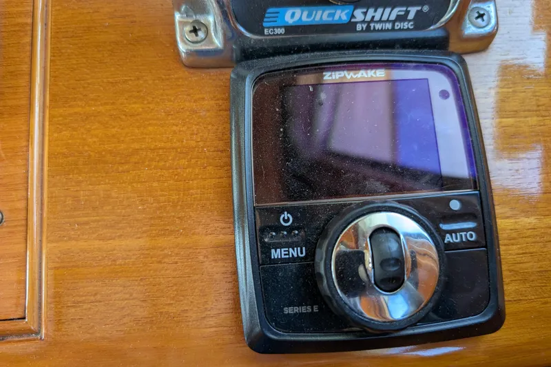 Slide: The Image of Control panel on a 2006 Grand Banks 49 Eastbay SX yacht, featuring Zipwake and QuickShift systems. - 37