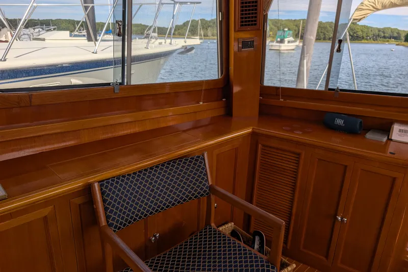 Slide: The Image of Interior of 2006 Grand Banks 49 Eastbay SX yacht with wooden cabinetry and seating. - 42