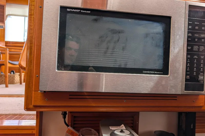 Slide: The Image of Sharp Carousel convection microwave in 2006 Grand Banks 49 Eastbay SX yacht interior. - 47