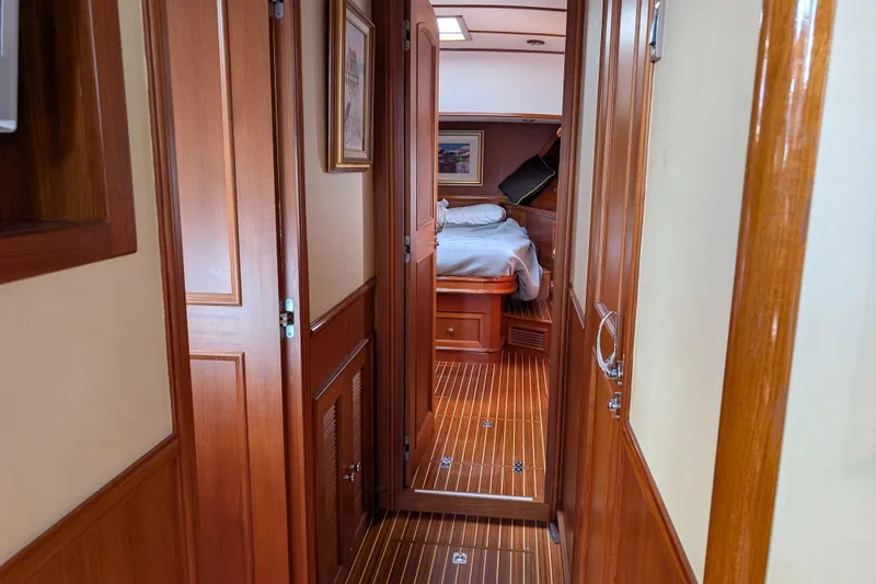 Slide: The Image of Luxurious wooden interior of 2006 Grand Banks 49 Eastbay SX yacht cabin. - 65