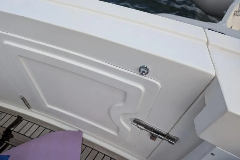 Slide: The Image of 2006 Grand Banks 49 Eastbay SX boat deck detail with white panel and hinge. - 18