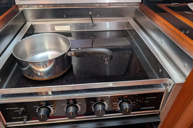 Slide: The Image of Stove with pot in 2006 Grand Banks 49 Eastbay SX yacht kitchen. - 48