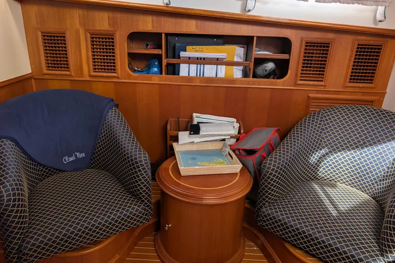 Slide: The Image of Interior of 2006 Grand Banks 49 Eastbay SX with elegant seating and wooden cabinetry. - 52
