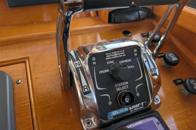 Slide: The Image of Control panel of a 2006 Grand Banks 49 Eastbay SX yacht, featuring gear shifter and controls. - 32
