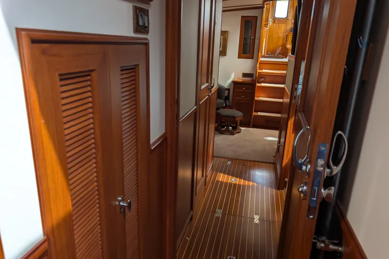Slide: The Image of Interior of 2006 Grand Banks 49 Eastbay SX yacht with wooden finishes and cozy seating. - 63