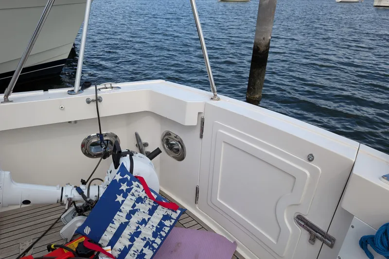Slide: The Image of 2006 Grand Banks 49 Eastbay SX boat deck with nautical accessories and ocean view. - 19