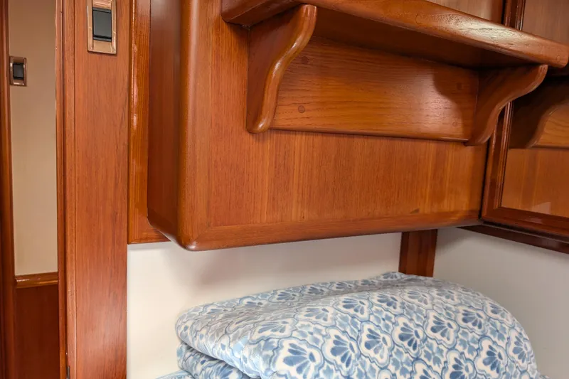 Slide: The Image of Wooden interior of 2006 Grand Banks 49 Eastbay SX with patterned fabric. - 56