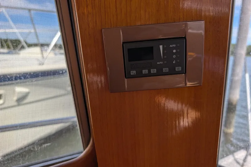 Slide: The Image of Control panel on 2006 Grand Banks 49 Eastbay SX yacht, wooden interior, window view. - 45