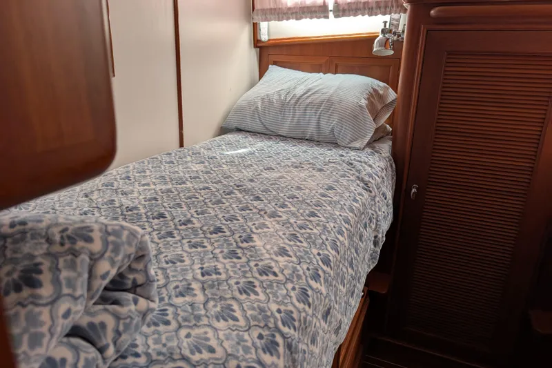 Slide: The Image of Cozy cabin bed with patterned bedding on 2006 Grand Banks 49 Eastbay SX yacht. - 55