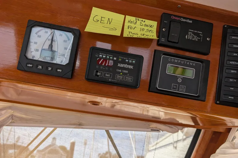 Slide: The Image of Control panel of a 2006 Grand Banks 49 Eastbay SX yacht with various instruments. - 29
