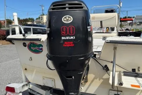 Slide: The Image of 2006 Carolina Skiff 178 DLX with Suzuki 90 outboard motor, parked on a trailer. - 5