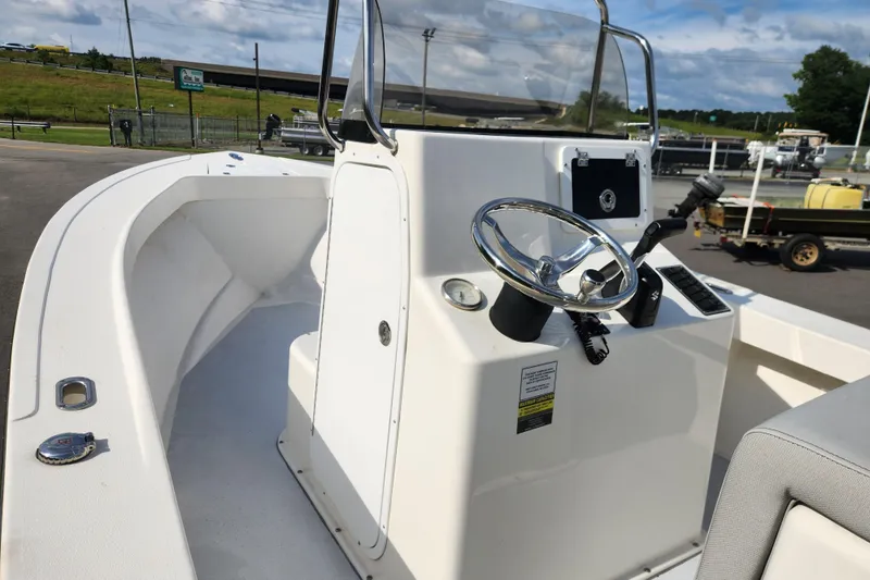 Slide: The Image of 2023 May-Craft 20 Cape Classic boat console with steering wheel and controls. - 10