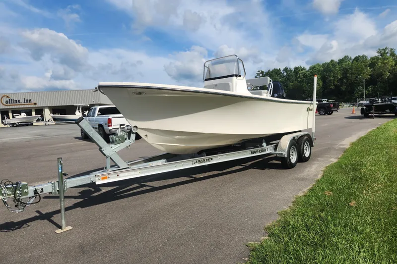 Slide: The Image of 2023 May-Craft 20 Cape Classic boat on trailer in parking lot, under blue sky. - 7