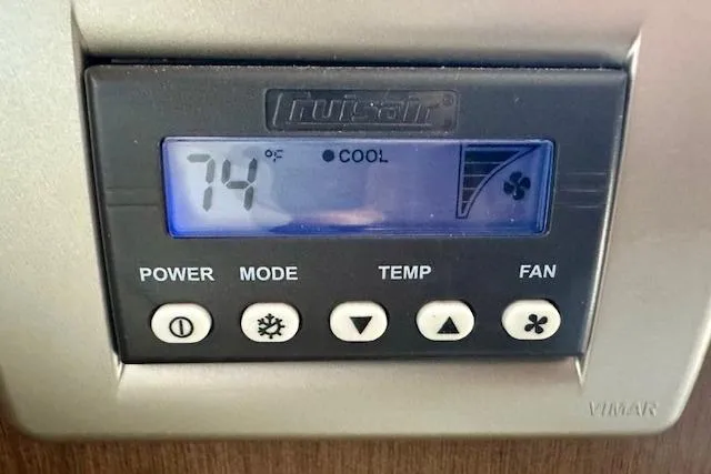 Slide: The Image of Digital thermostat display on 2014 Sea Ray 350 Sundancer, showing 74°F in cooling mode. - 16
