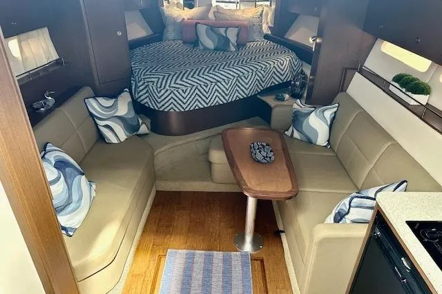 Slide: The Image of Interior of 2014 Sea Ray 350 Sundancer with cozy seating and stylish decor. - 17