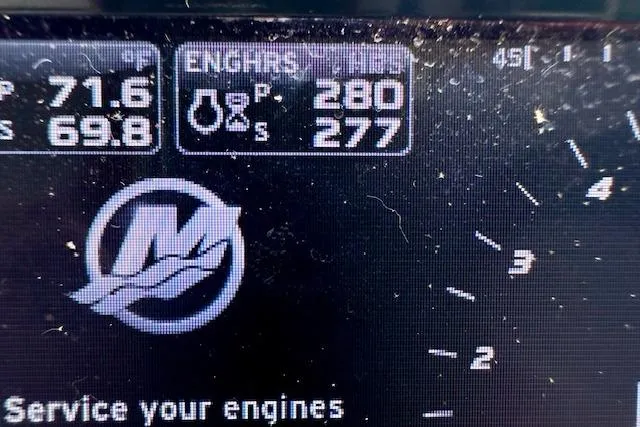 Slide: The Image of Close-up of a 2014 Sea Ray 350 Sundancer engine display showing temperature and RPM. - 21