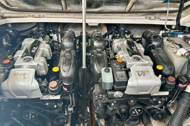 Slide: The Image of Twin engines of a 2014 Sea Ray 350 Sundancer boat, showcasing powerful V8 design. - 22