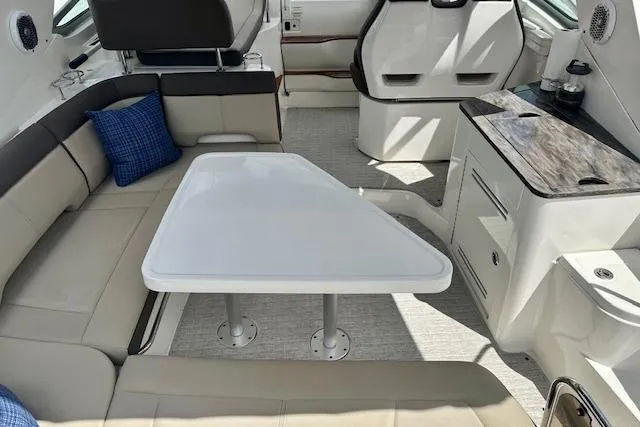 Slide: The Image of Interior of 2014 Sea Ray 350 Sundancer with seating and table. - 4