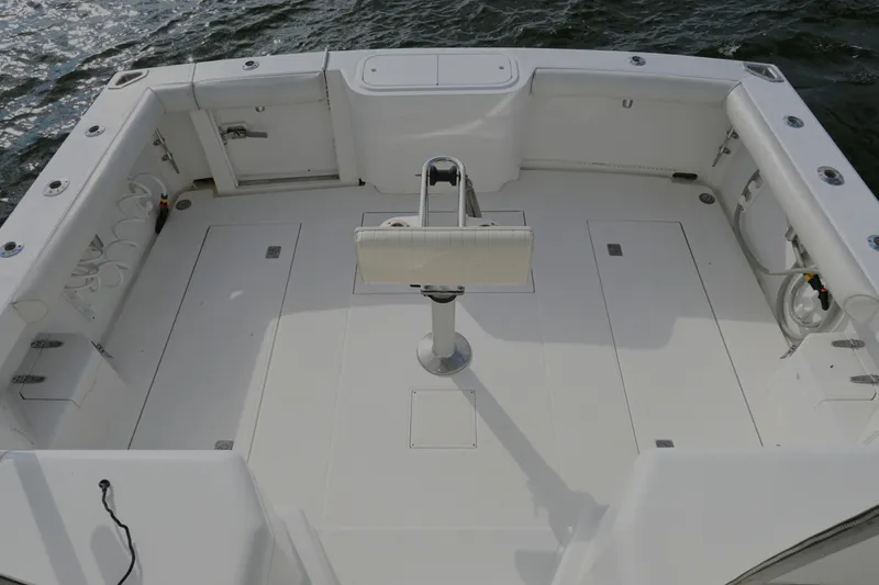 Slide: The Image of Spacious deck of 2001 Cabo 35 Express boat, featuring clean white surfaces. - 20