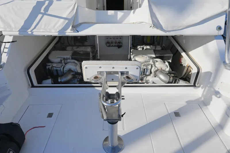 Slide: The Image of 2001 Cabo 35 Express engine compartment with open hatch, showcasing dual engines. - 41