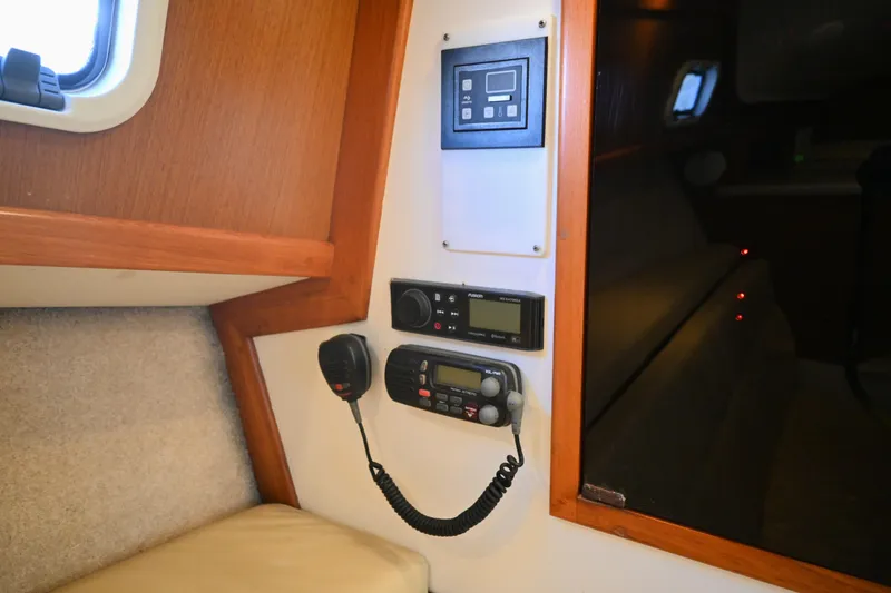 Slide: The Image of Interior of 2001 Cabo 35 Express boat with communication equipment and control panel. - 51