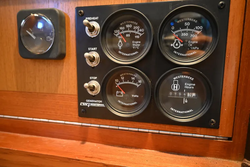 Slide: The Image of Control panel of a 2001 Cabo 35 Express boat with Westerbeke gauges. - 53