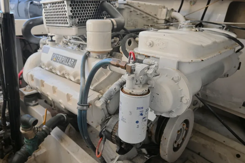 Slide: The Image of Engine of a 2001 Cabo 35 Express boat, featuring a Caterpillar component. - 59
