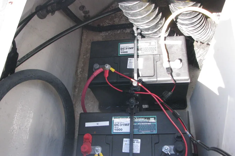 Slide: The Image of 2020 Chaparral 23 Surf boat battery compartment with dual DC31MF batteries. - 12