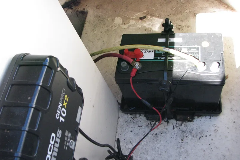 Slide: The Image of Battery setup in a 2020 Chaparral 23 Surf boat with NOCO Genius charger. - 13